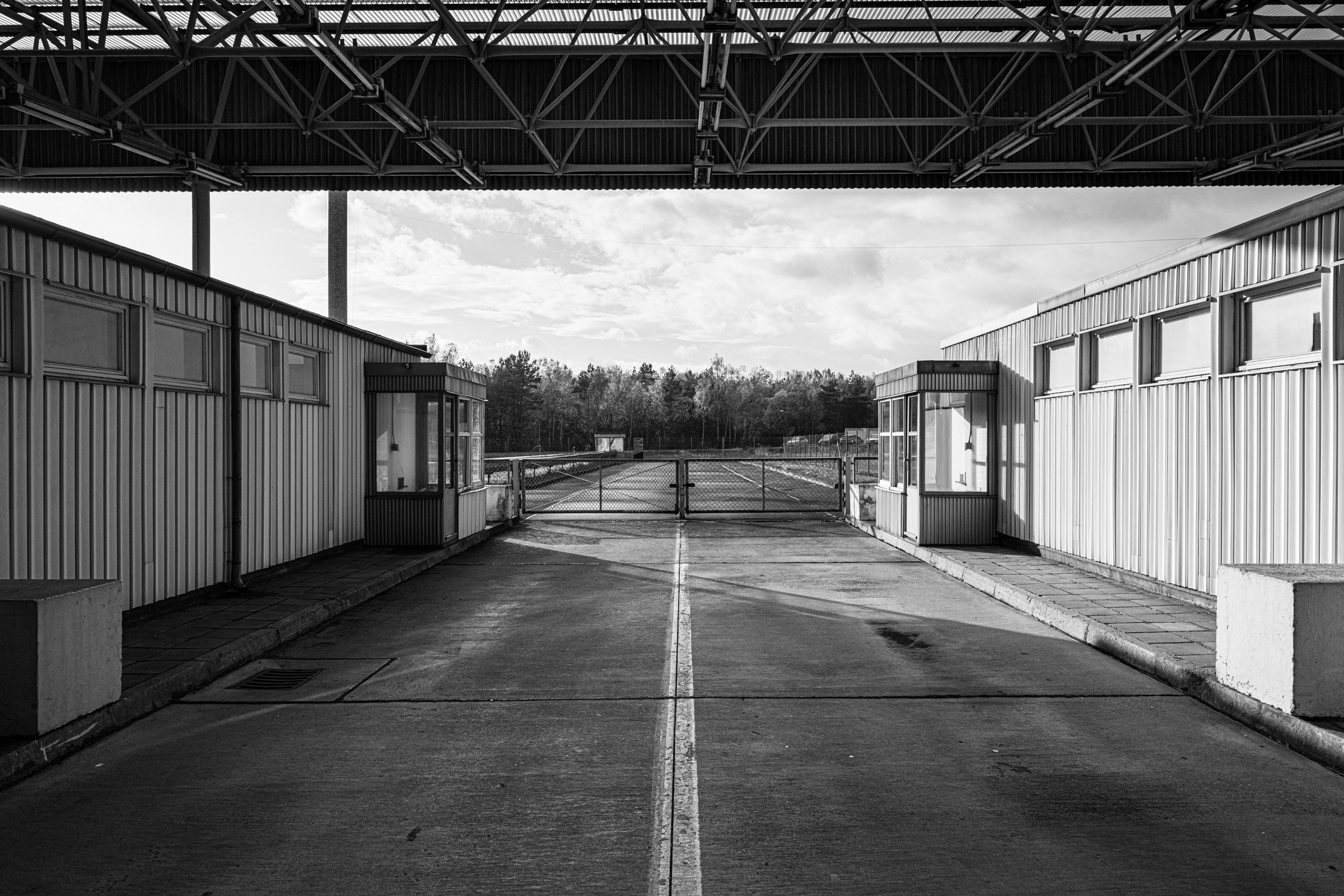Gated passage between checkpoint booths, Marienborn, 2023