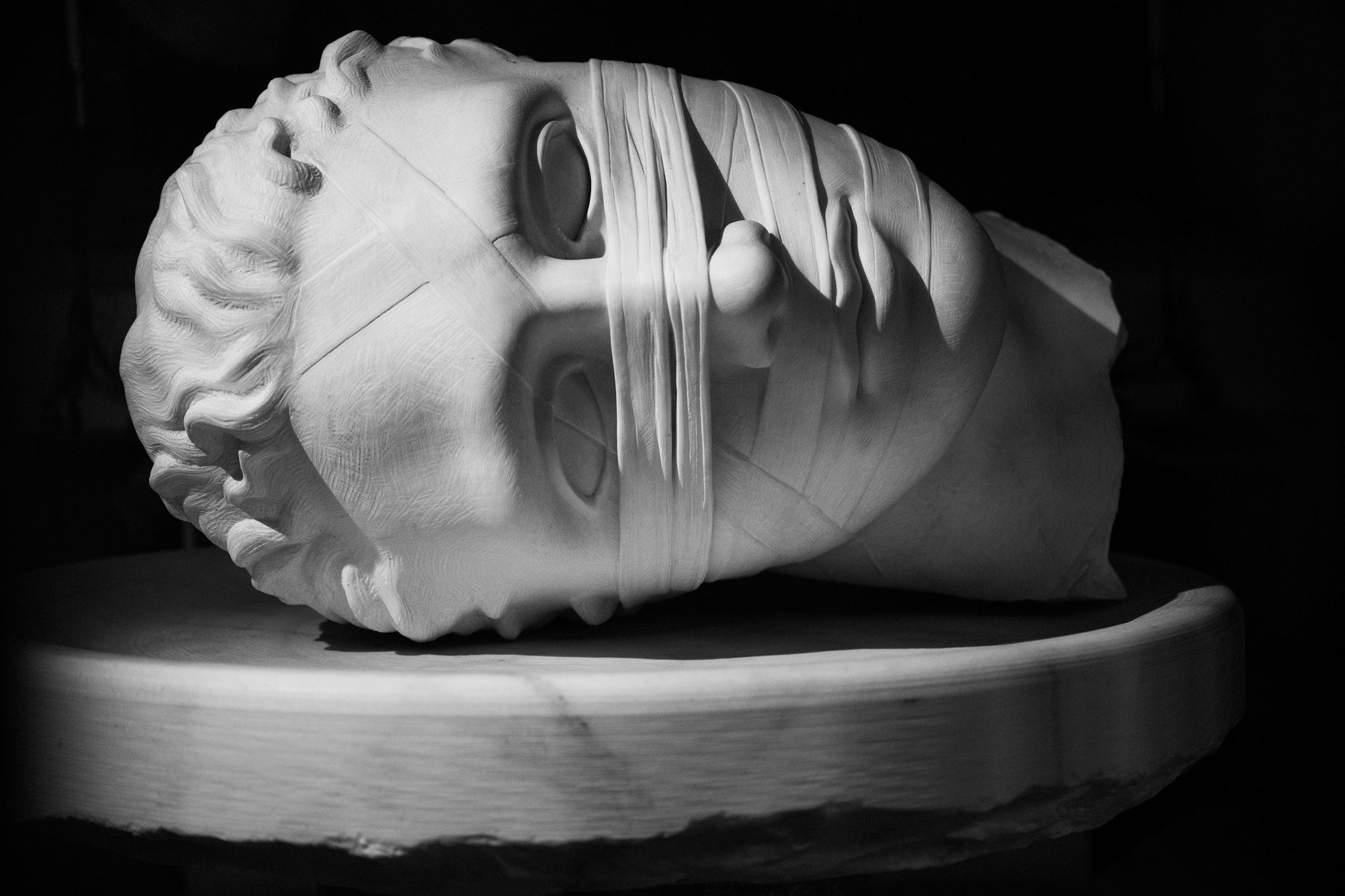 Sculpted head with a band across the eyes, Rome, 2023